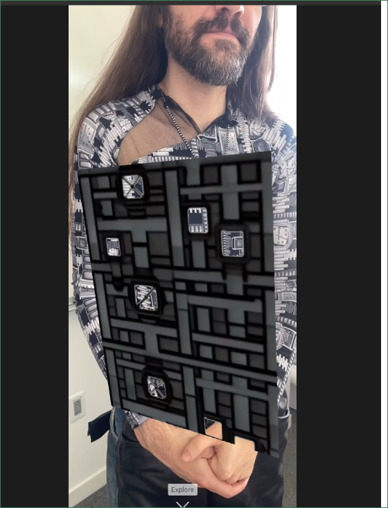 A geometric, layered wearable material study presented on the body.
